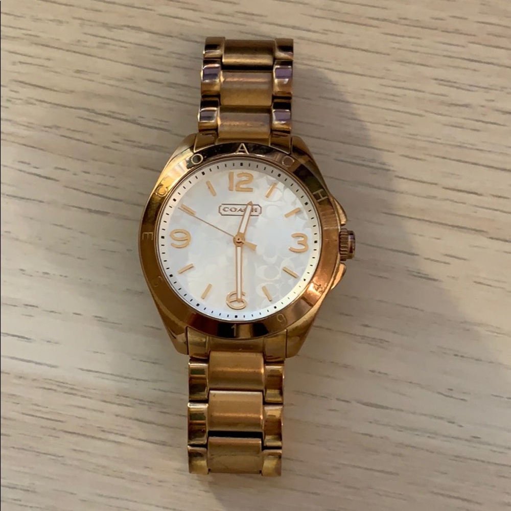 Rose gold coach watch.